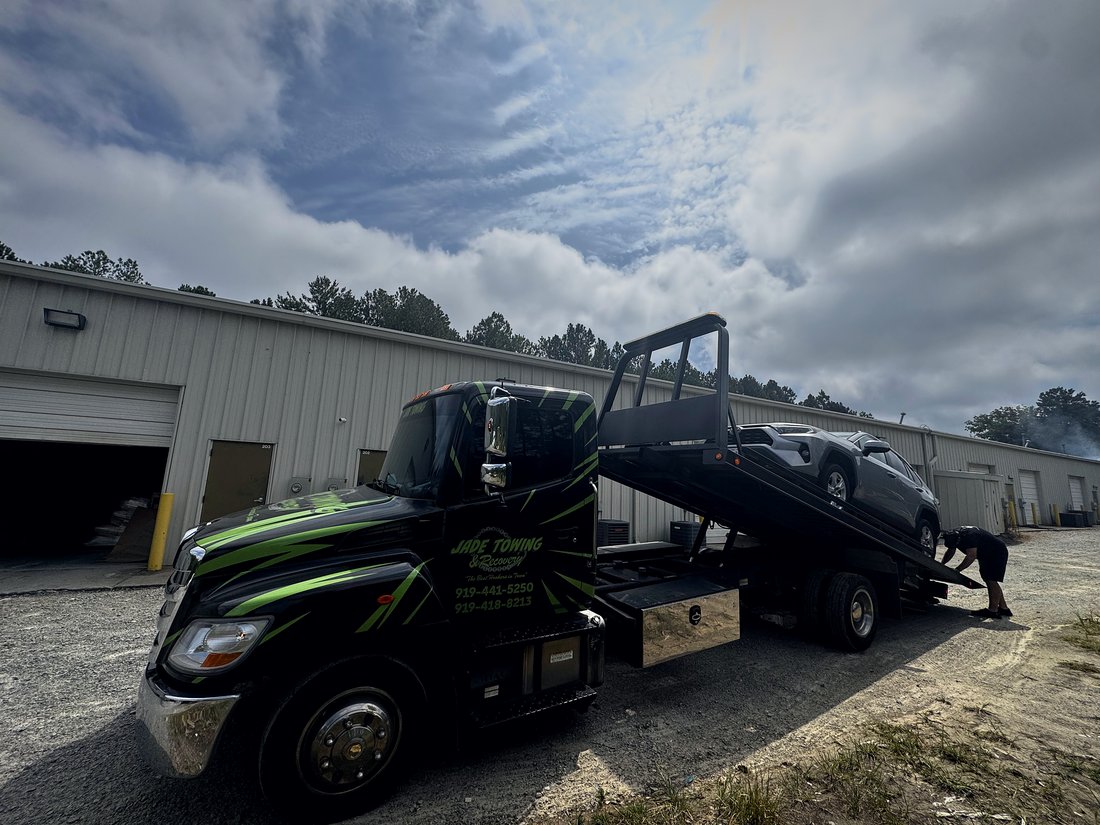 Front view of the black and green Jade Towing rollback